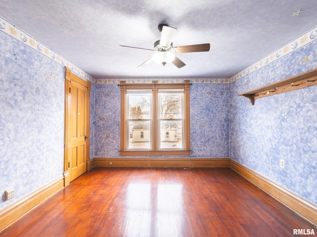 spare room featuring ceiling fan and wood-type flooring