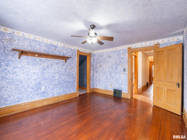 spare room with hardwood / wood-style flooring and ceiling fan