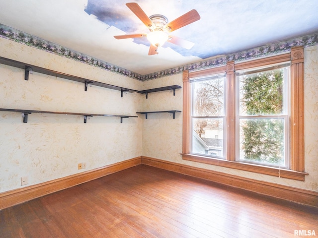 unfurnished room featuring hardwood / wood-style flooring and ceiling fan