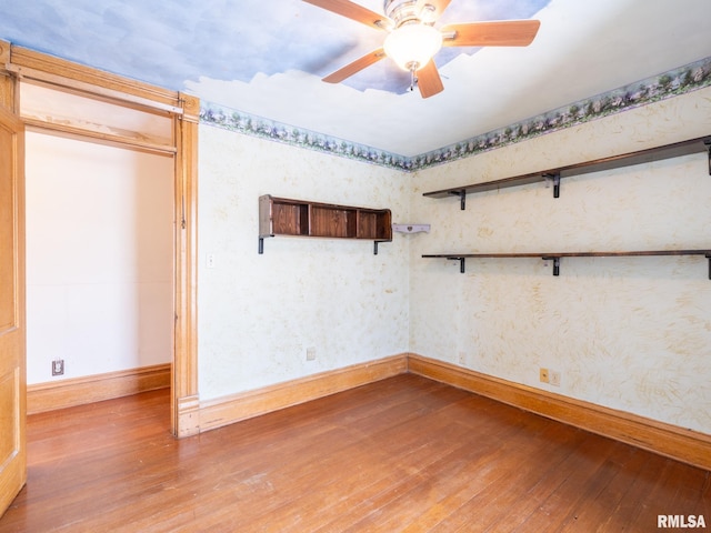 unfurnished room with hardwood / wood-style floors and ceiling fan