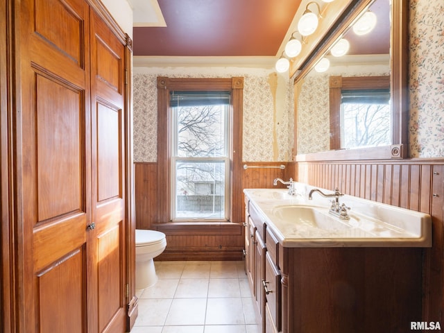 bathroom featuring a wealth of natural light, wooden walls, and tile patterned flooring