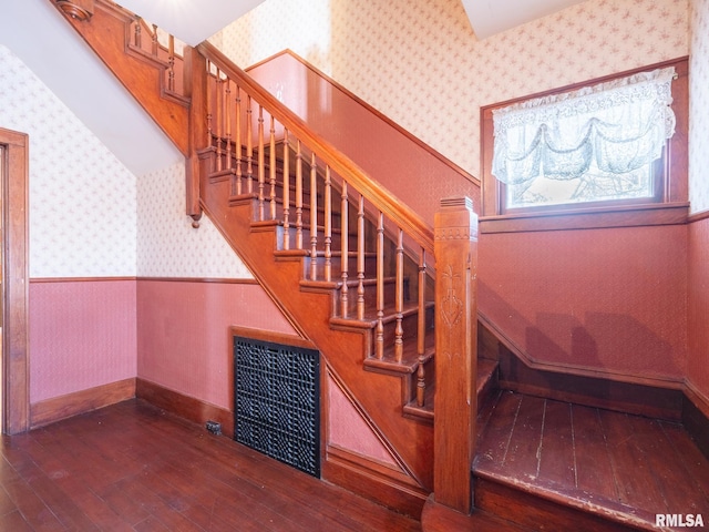 stairs featuring wood-type flooring