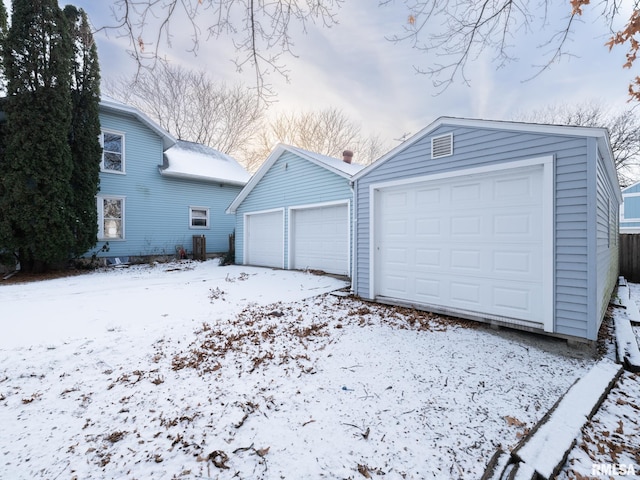 view of snow covered garage