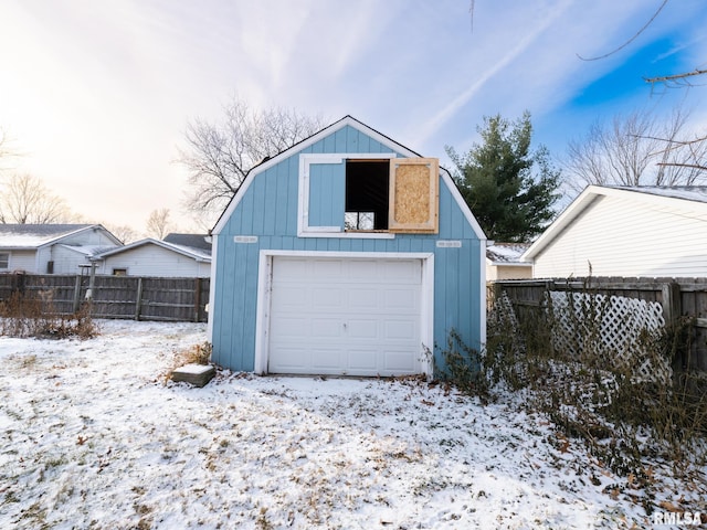 view of snow covered garage