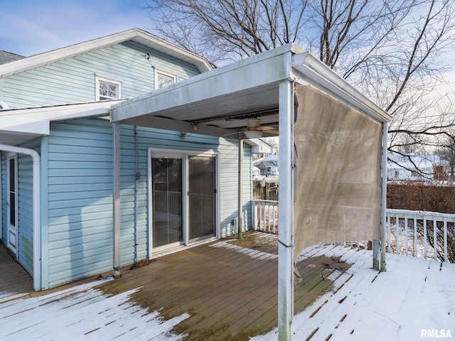 view of snow covered deck