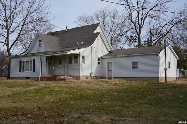 back of house with a yard