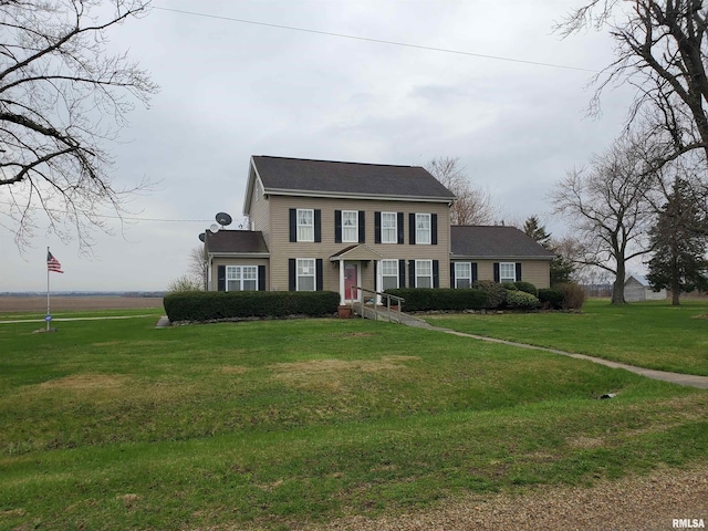 colonial home with a front lawn