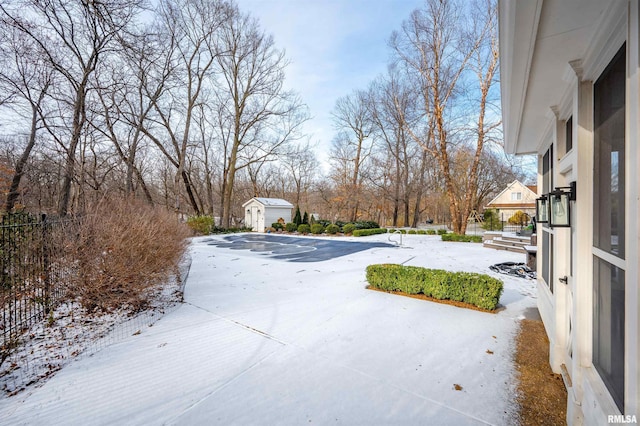 view of yard layered in snow