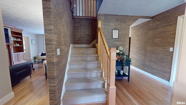 stairway featuring hardwood / wood-style floors