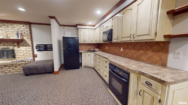 kitchen featuring sink, backsplash, black appliances, crown molding, and a brick fireplace