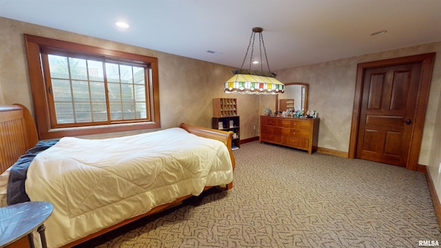 bedroom with light colored carpet