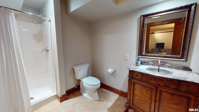 bathroom with vanity, tile patterned flooring, a shower with curtain, and toilet