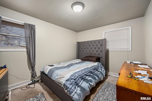 carpeted bedroom featuring a baseboard radiator