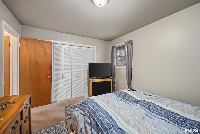 carpeted bedroom featuring a closet