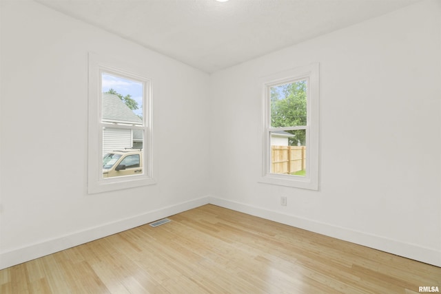 spare room with light hardwood / wood-style floors