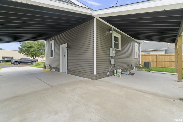 view of home's exterior featuring a carport and central air condition unit