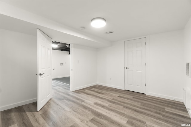 basement with wood-type flooring