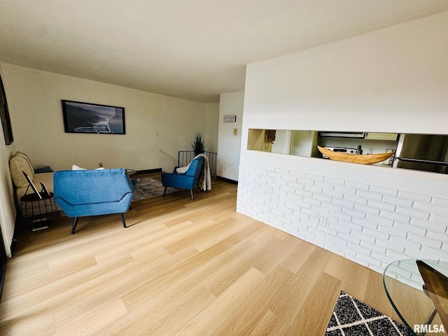 sitting room featuring wood-type flooring