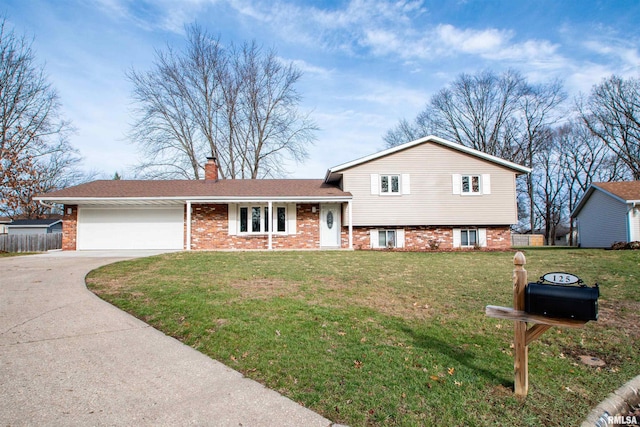 tri-level home featuring a front lawn and a garage