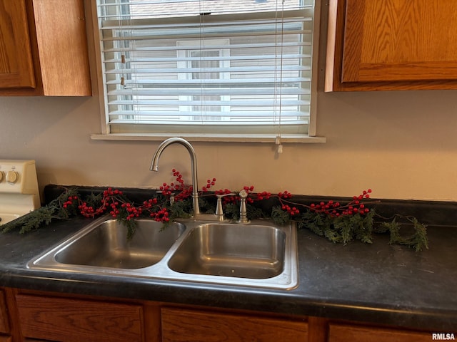 kitchen featuring a wealth of natural light and sink