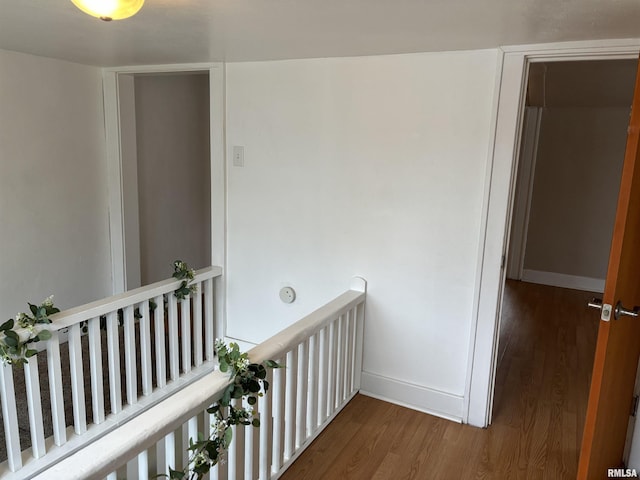 corridor featuring hardwood / wood-style floors