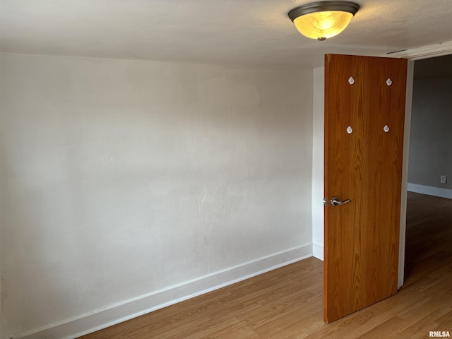 spare room featuring hardwood / wood-style floors