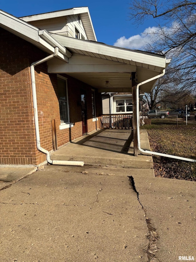 view of side of property featuring a carport