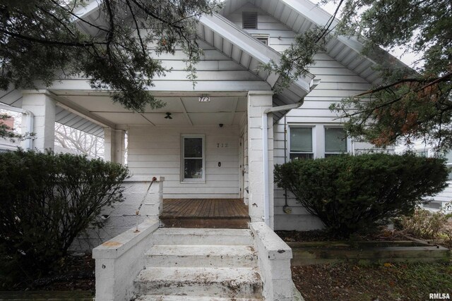 entrance to property with covered porch