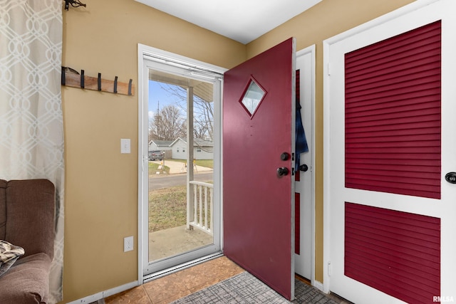 doorway with tile patterned flooring