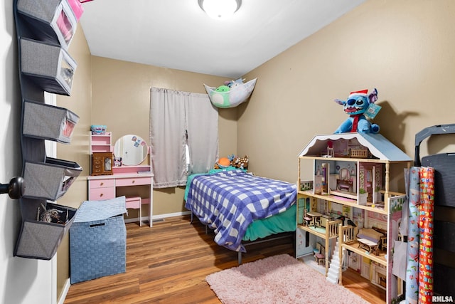 bedroom with wood-type flooring