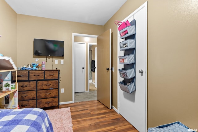 bedroom featuring dark hardwood / wood-style flooring