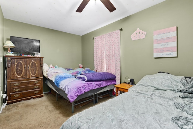 bedroom with ceiling fan and light carpet