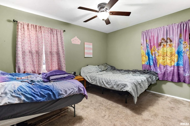 bedroom with ceiling fan and carpet