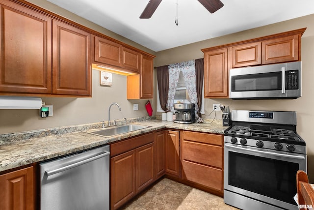 kitchen with ceiling fan, sink, light stone countertops, and stainless steel appliances