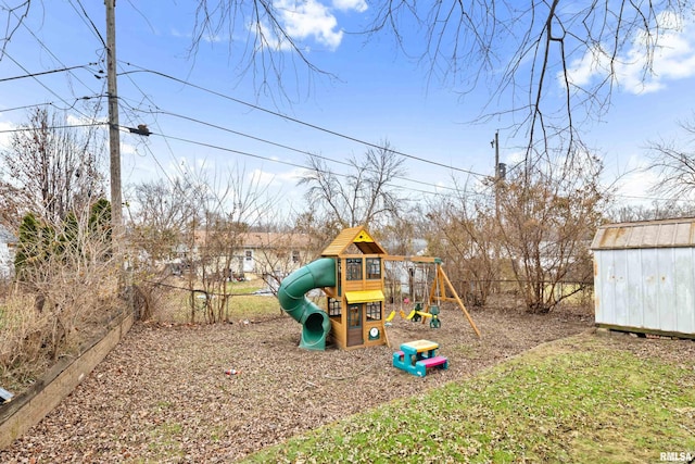 view of jungle gym featuring a shed