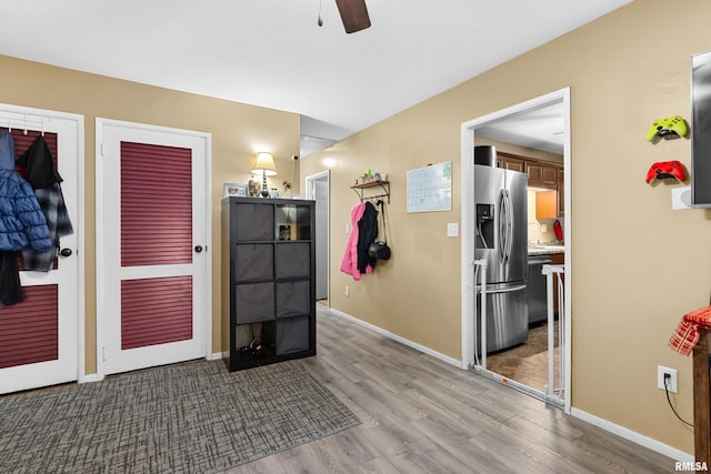 interior space featuring light wood-type flooring and ceiling fan