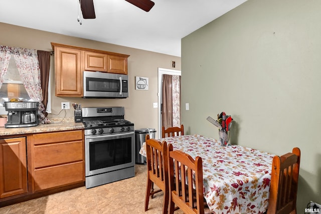 kitchen with light stone countertops and stainless steel appliances