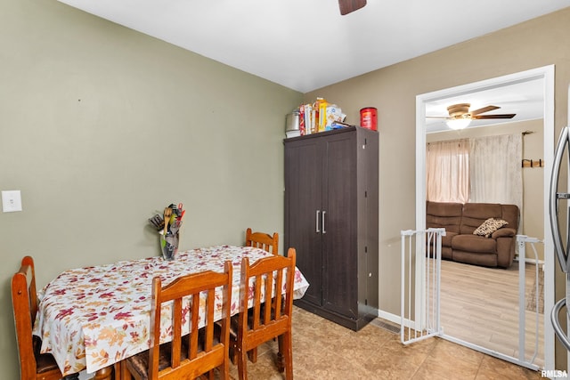 dining space with ceiling fan