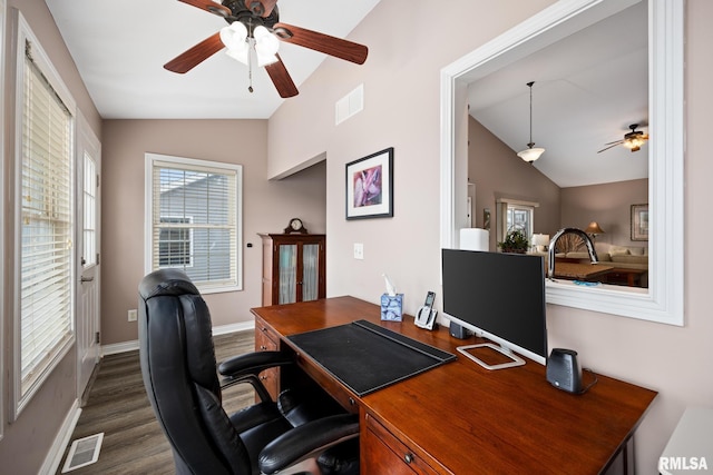 home office featuring dark wood-type flooring and lofted ceiling