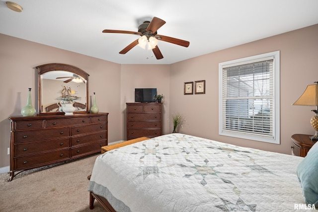 carpeted bedroom featuring ceiling fan