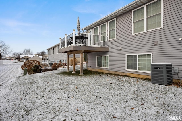 back of property featuring central AC unit