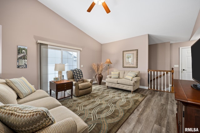 living room with ceiling fan, dark hardwood / wood-style flooring, and high vaulted ceiling