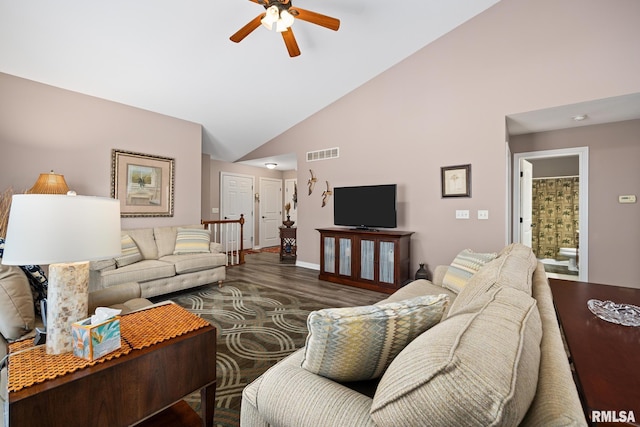 living room with ceiling fan, wood-type flooring, and high vaulted ceiling