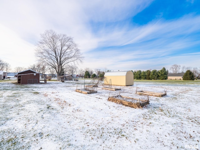 yard covered in snow with an outdoor structure