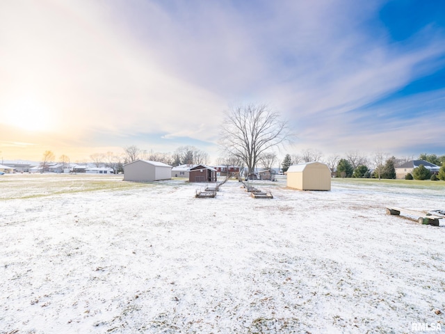 yard at dusk featuring a storage shed