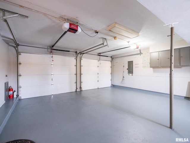 garage featuring electric panel and a garage door opener