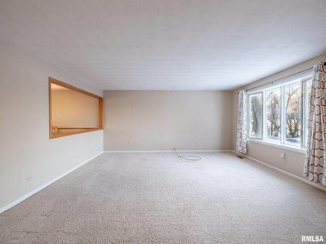 spare room featuring carpet flooring