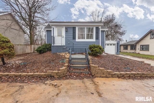 view of front of home featuring an outdoor structure and a garage