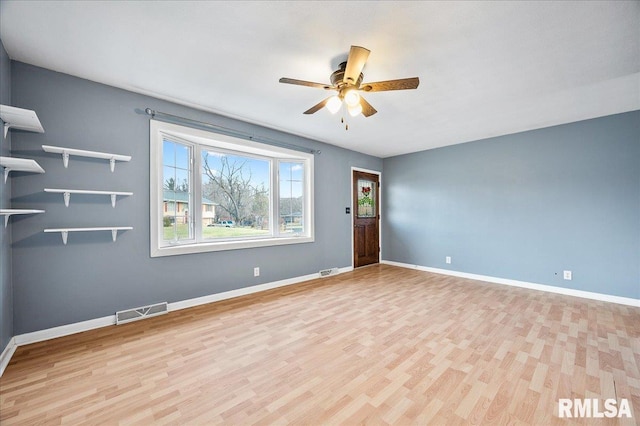 unfurnished room with light hardwood / wood-style flooring and ceiling fan