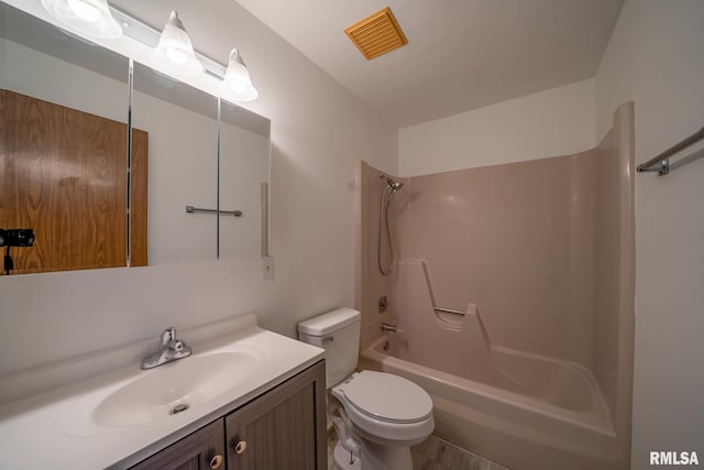 full bathroom with visible vents, toilet, vanity, and shower / tub combination